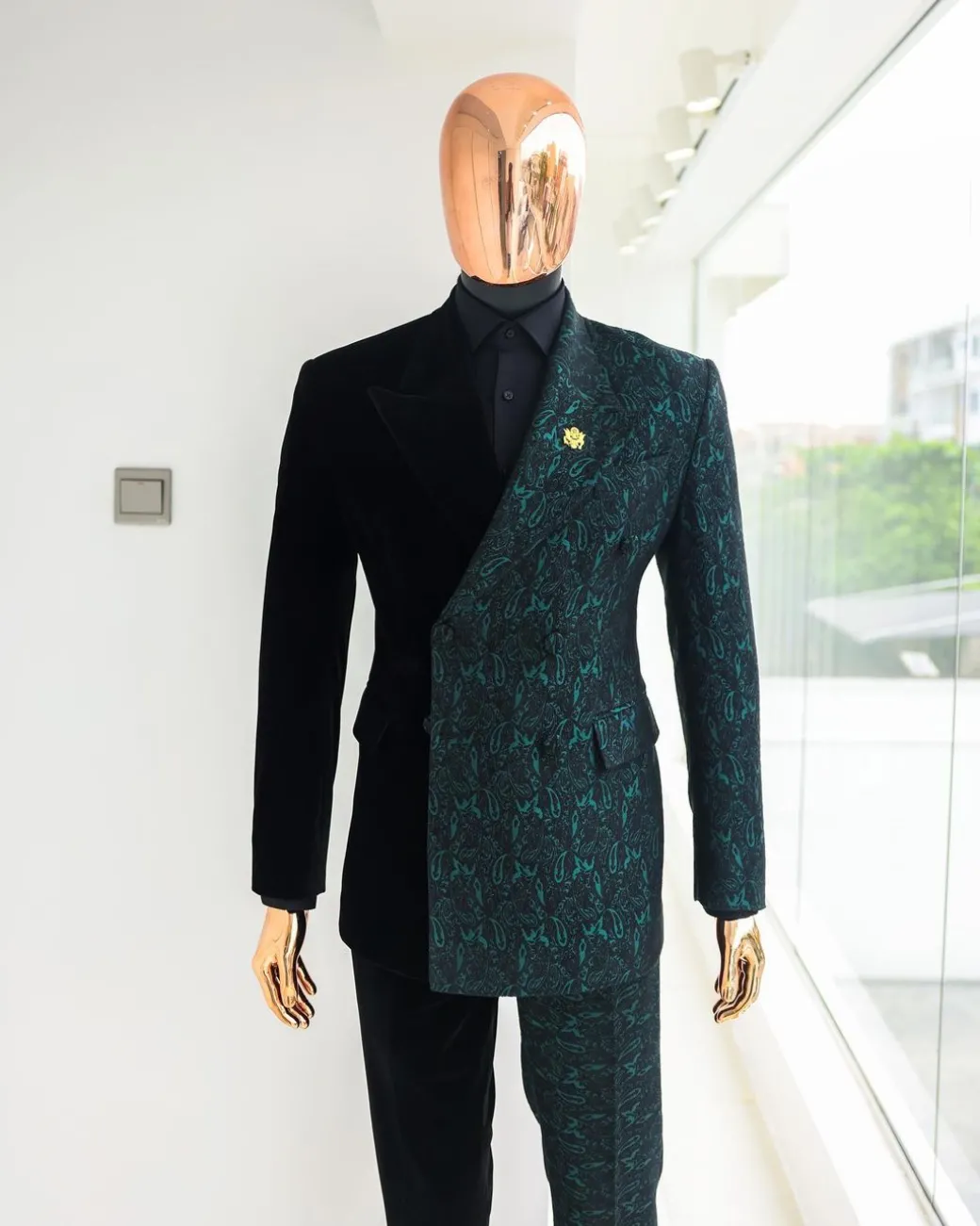 An Emerald green & black “rival” 1/4 cut ocean element peak lapel double breasted jacquard suit