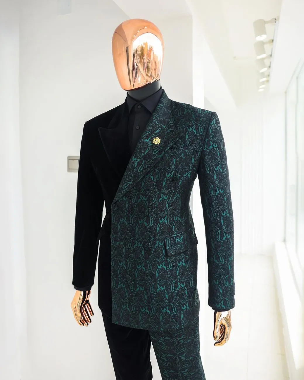 An Emerald green & black “rival” 1/4 cut ocean element peak lapel double breasted jacquard suit