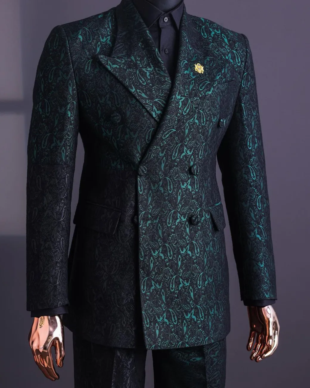 An Emerald green & black “rival” 1/4 cut ocean element peak lapel double breasted jacquard suit.