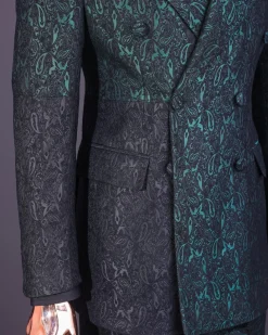 An Emerald green & black “rival” 1/4 cut ocean element peak lapel double breasted jacquard suit.
