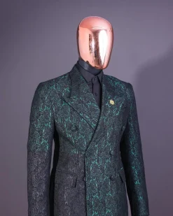 An Emerald green & black “rival” 1/4 cut ocean element peak lapel double breasted jacquard suit.