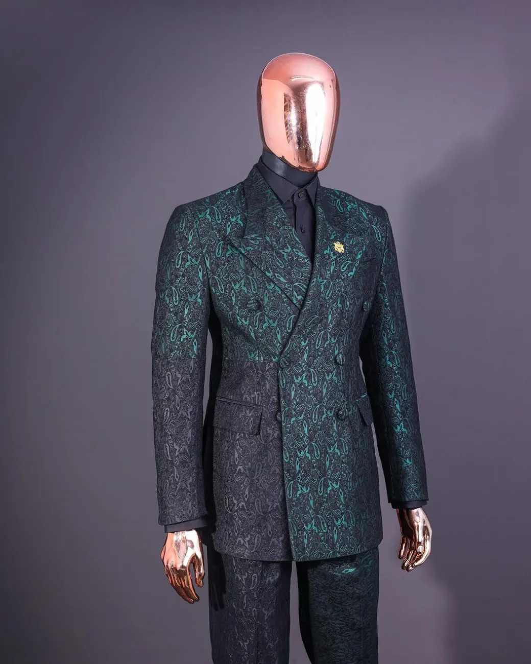 An Emerald green & black “rival” 1/4 cut ocean element peak lapel double breasted jacquard suit.