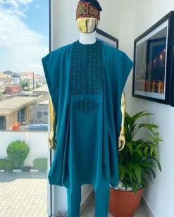 An emerald green, connected square embroidery design with matching green and red Swarovski stone details agbada