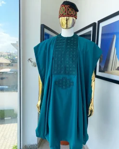 An emerald green, connected square embroidery design with matching green and red Swarovski stone details agbada