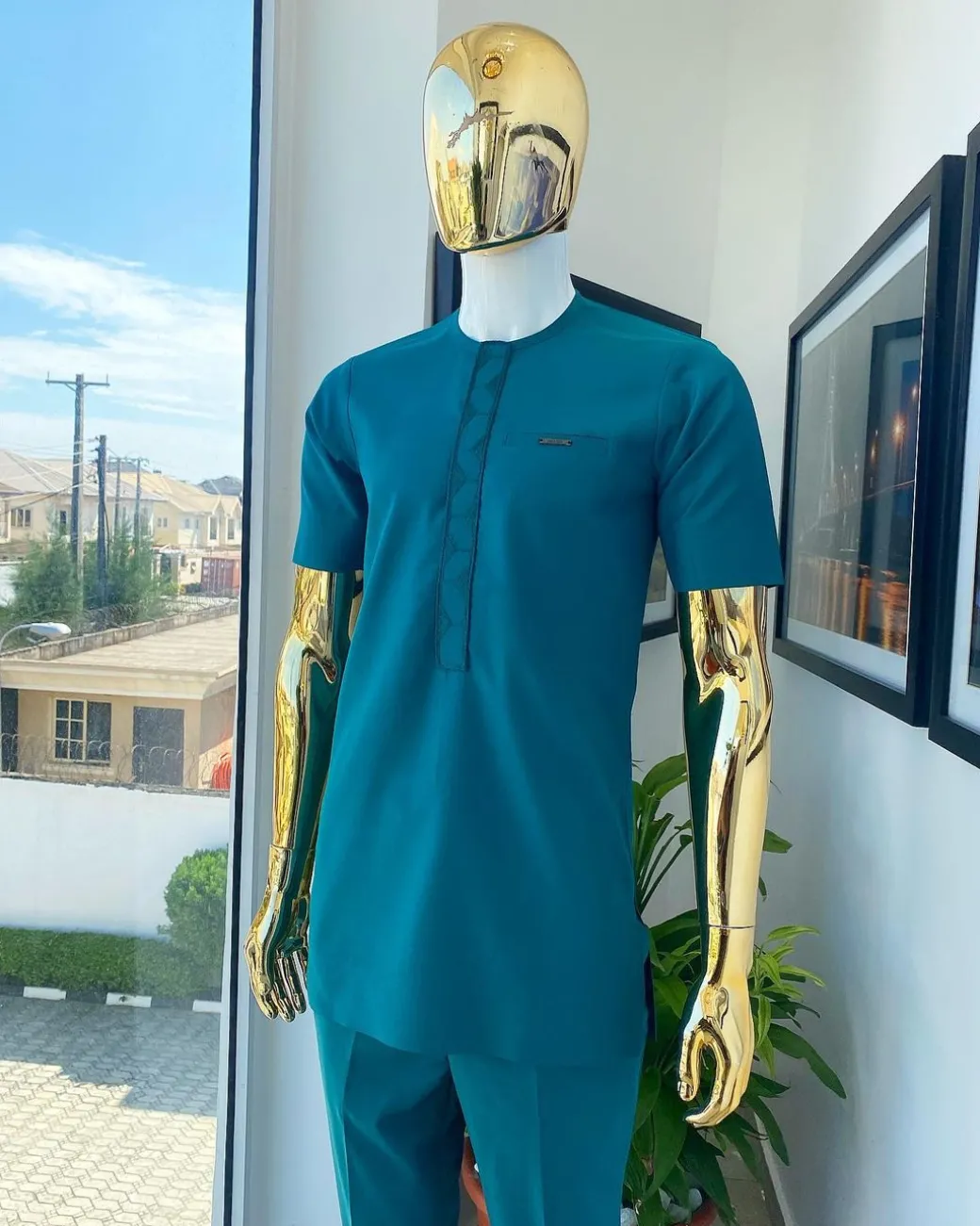 An emerald green embroidery detailing African traditional senator kaftan native