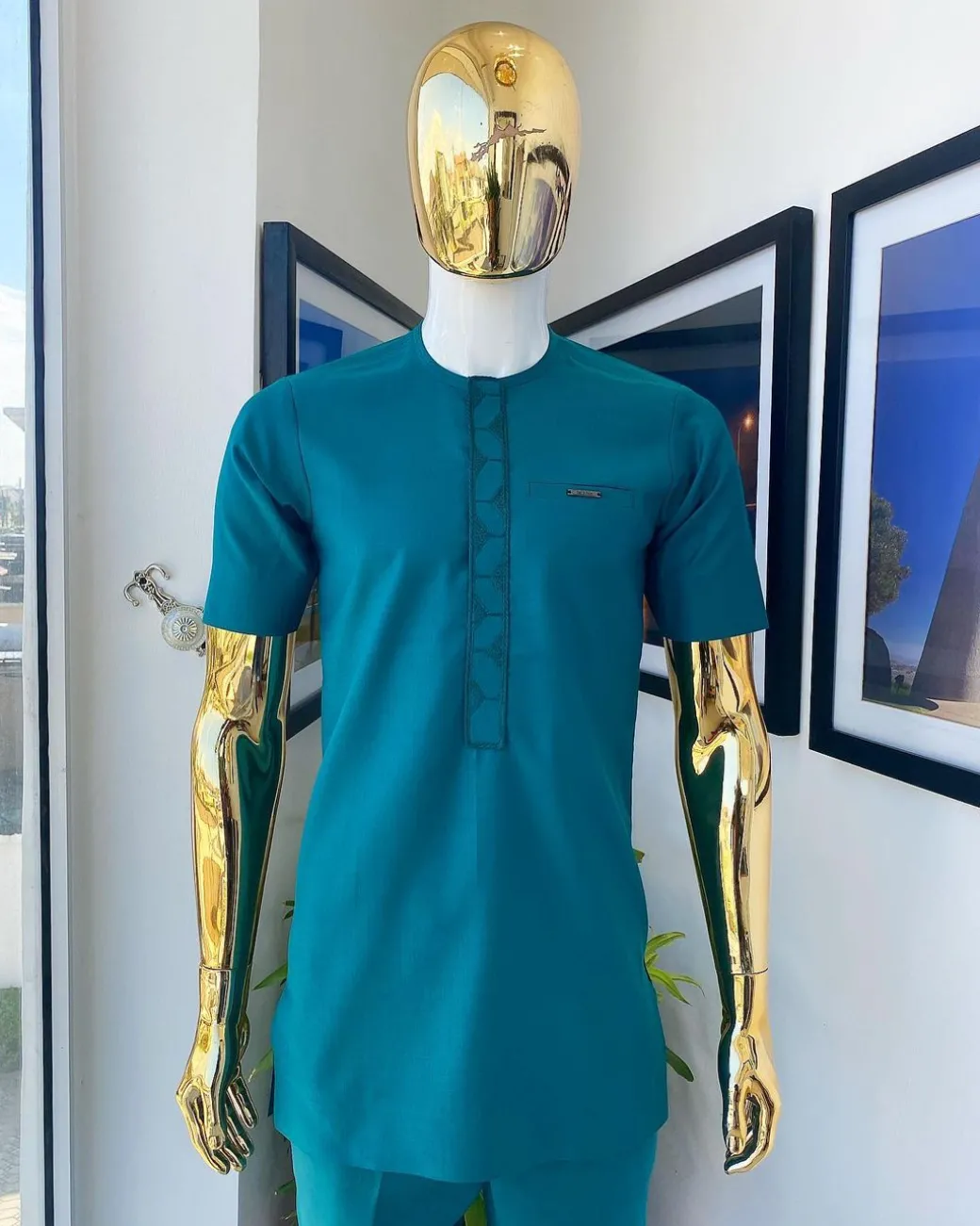 An emerald green embroidery detailing African traditional senator kaftan native