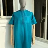 An emerald green front flap and traditional embroidery senator kaftan