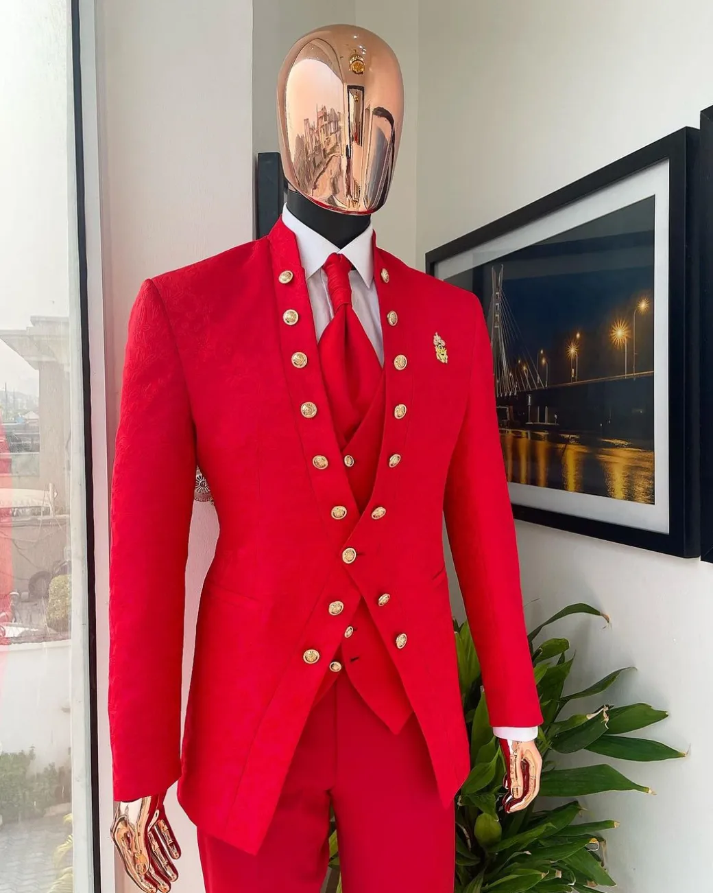 An “Empire” candy red, floral patterned metallic jacquard suit