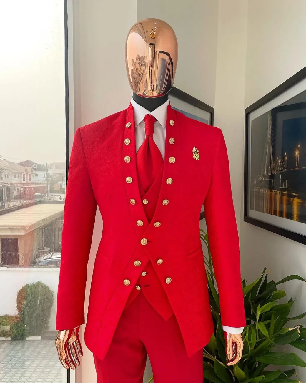 An “Empire” candy red, floral patterned metallic jacquard suit