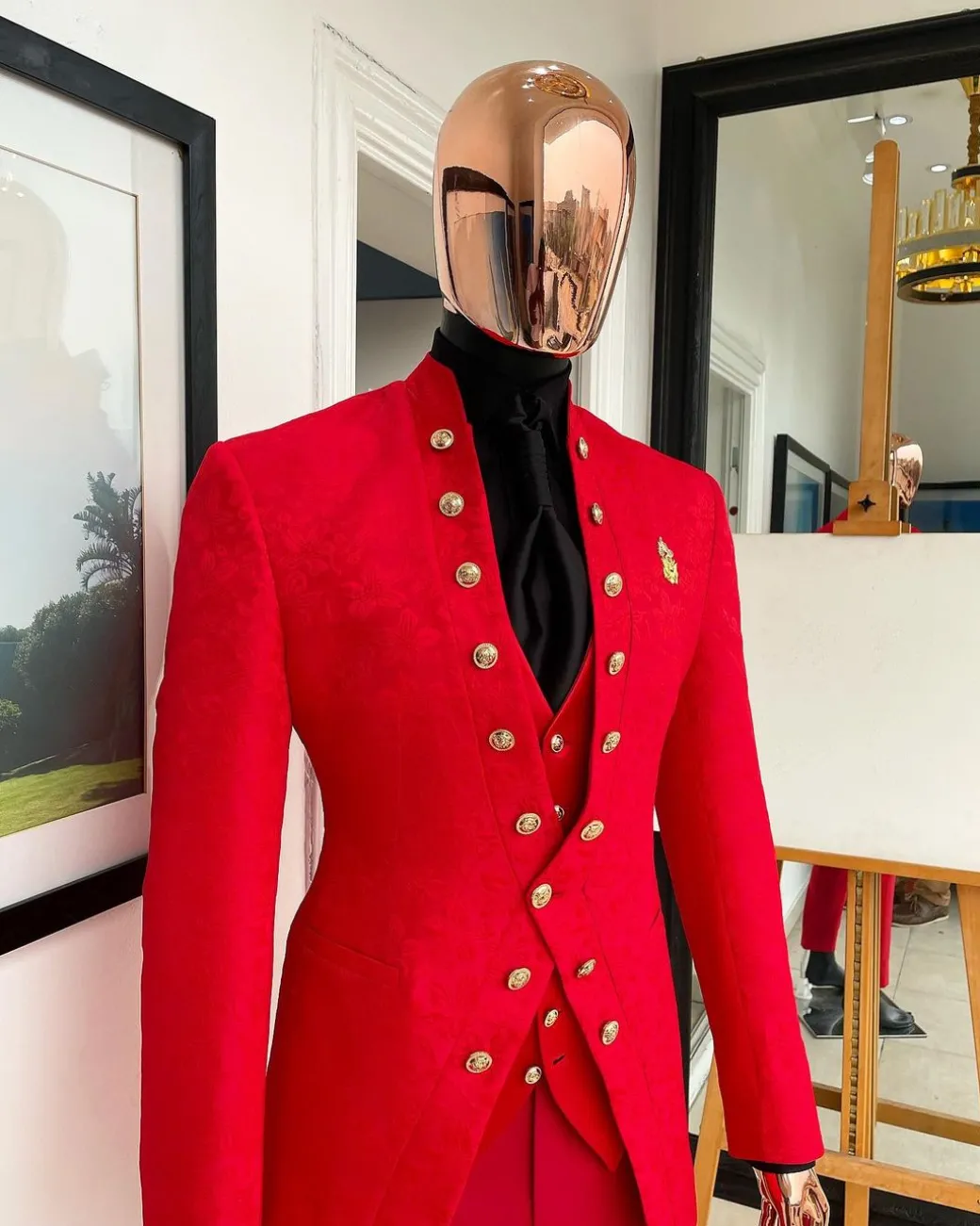 An “empire” candy red, floral patterned metallic jacquard suit