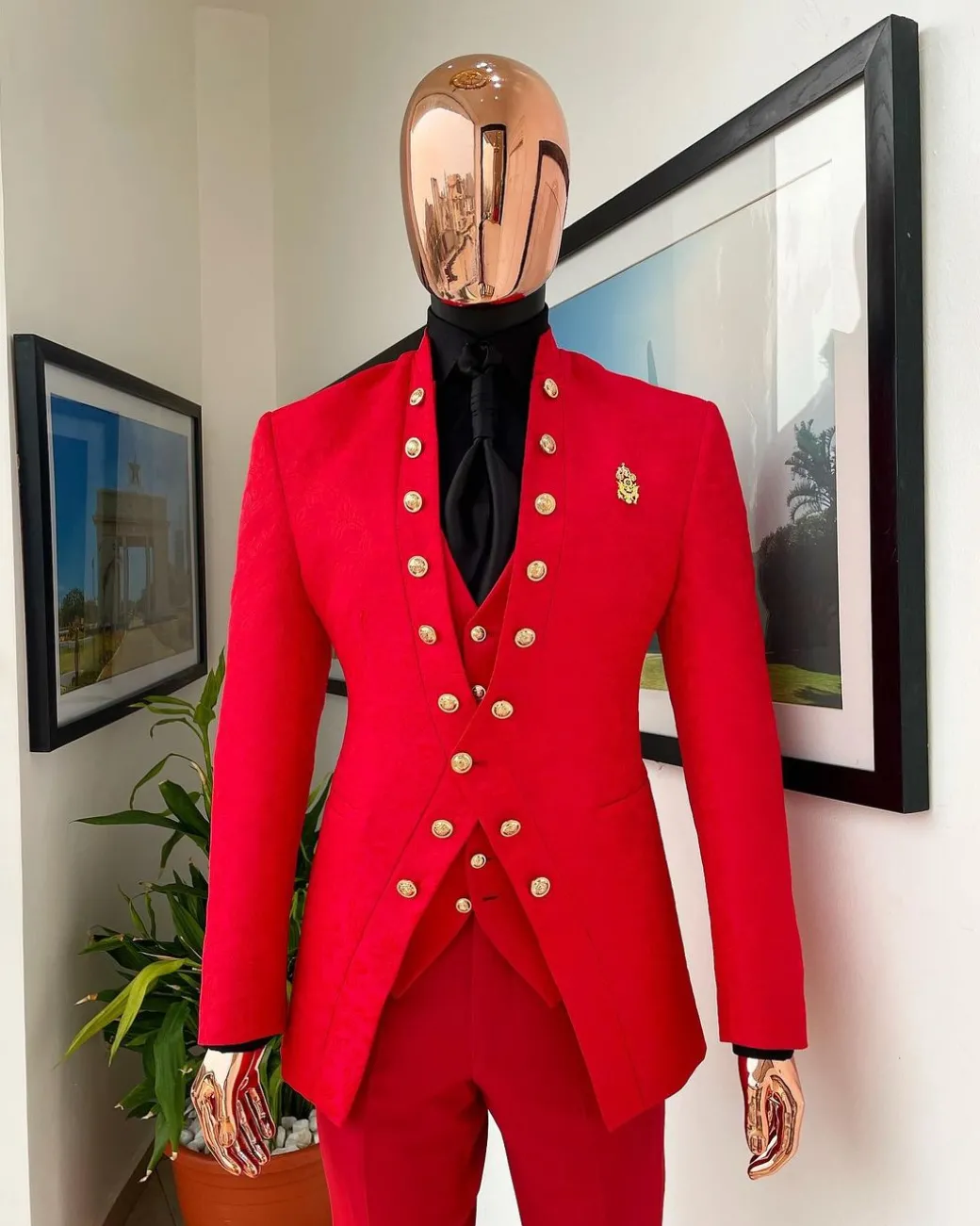 An “empire” candy red, floral patterned metallic jacquard suit