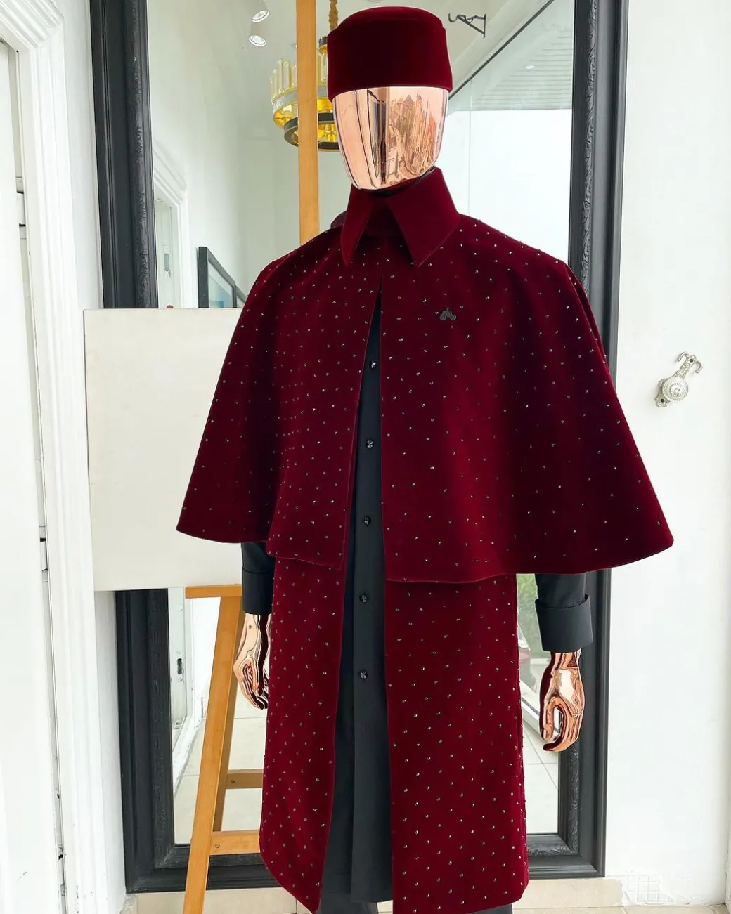 An “Eyes Wide Shut” mahogany red soaked Italian velvet Ceremonial suktan with black Swarovski stone detailing