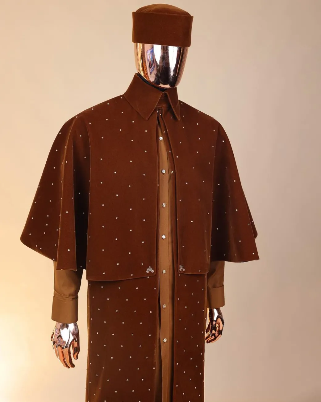 An “Eyes Wide Shut” syrup brown Italian velvet Ceremonial suktan with gold crystals Swarovski stone
