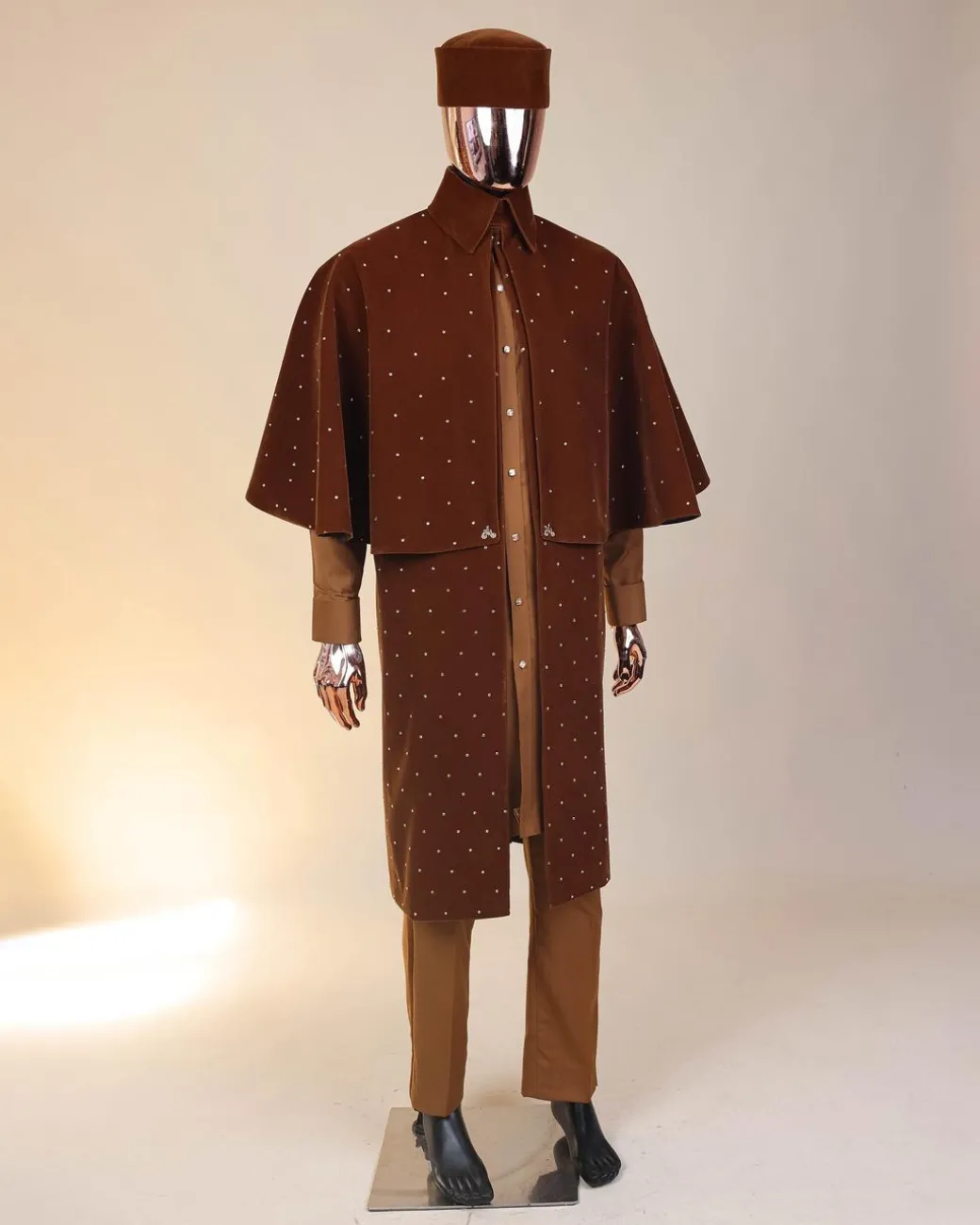 An “Eyes Wide Shut” syrup brown Italian velvet Ceremonial suktan with gold crystals Swarovski stone