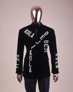 An “inscribe” your name charcoal black soaked velvet peak lapel wrap tuxedo suit