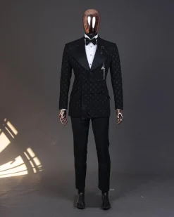 An Inverted “Pirate”, knitted, charcoal black with distributed square pattern jacquard peak lapel, 9 button tuxedo suit.