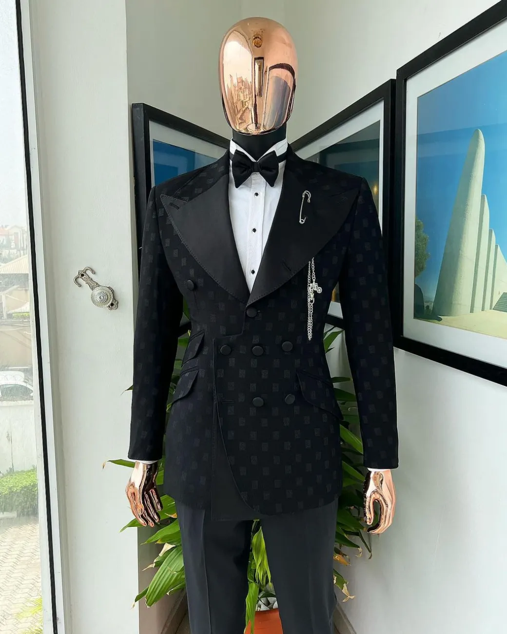 An Inverted “Pirate”, knitted, charcoal black with distributed square pattern jacquard peak lapel, 9 button tuxedo suit.