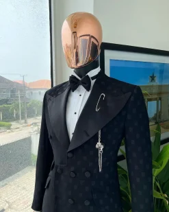 An Inverted “Pirate”, knitted, charcoal black with distributed square pattern jacquard peak lapel, 9 button tuxedo suit.