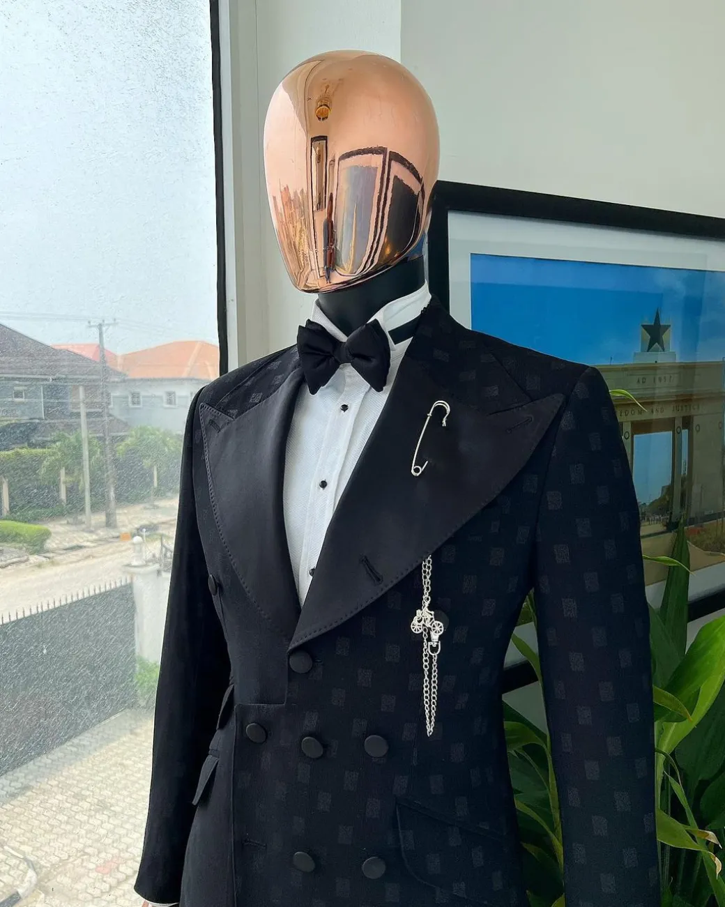 An Inverted “Pirate”, knitted, charcoal black with distributed square pattern jacquard peak lapel, 9 button tuxedo suit.