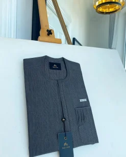 An invisible windowpane grey check, single pocket, front flap African traditional senator kaftan native.