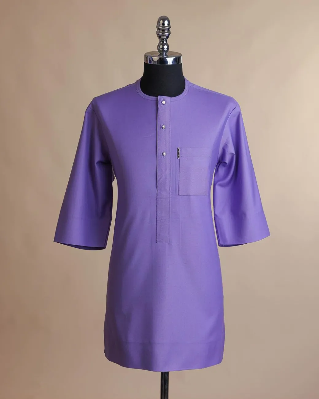 An iris purple, front flap with Swarovski button, 3/4 sleeve African senator kaftan native.