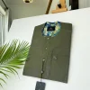 An Irish Green African kaftan with mixed shade of green paisley detailing