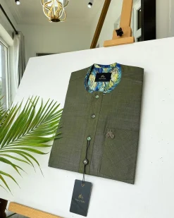An Irish Green African kaftan with mixed shade of green paisley detailing