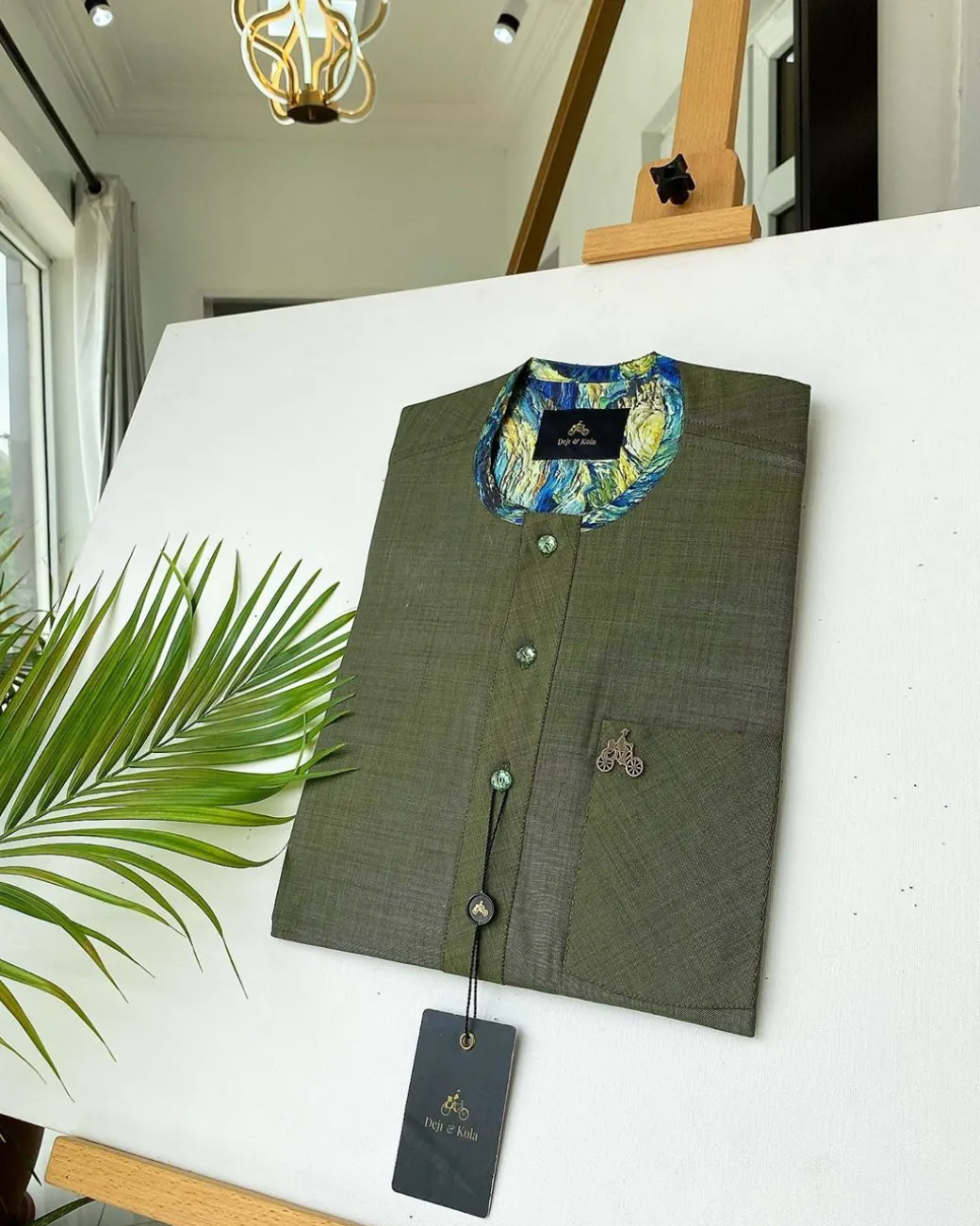 An Irish Green African kaftan with mixed shade of green paisley detailing