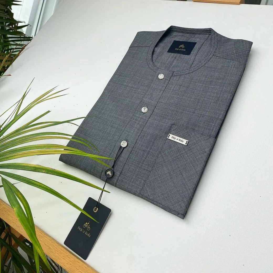 An Irish Grey African Kaftan with ABV diamond-shaped Australian Swarovski button