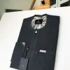 An Irish Grey Kaftan with a clear view of Swarovski button detailing