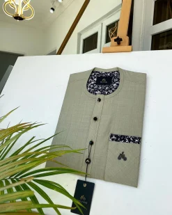 An Irish Light Brown kaftan with a Swarovski stone pocket and buttons