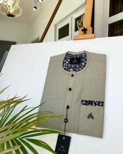 An Irish Light Brown kaftan with a Swarovski stone pocket and buttons