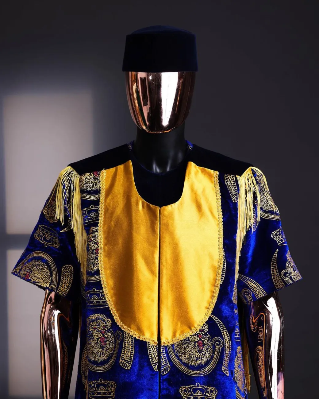 An “Isiagba” gold, blue with matching fringe details, short sleeve top & velvet pant African traditional native.
