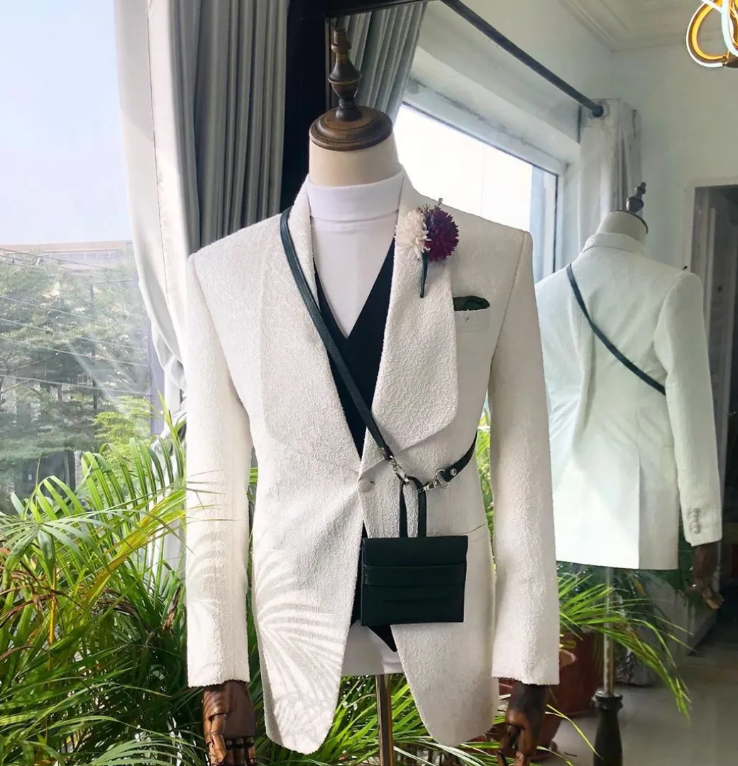 An Ivory White “Wedding In The Jungle” shawl lapel tuxedo suit