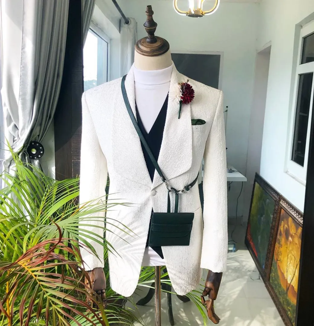 An Ivory White “Wedding In The Jungle” shawl lapel tuxedo suit