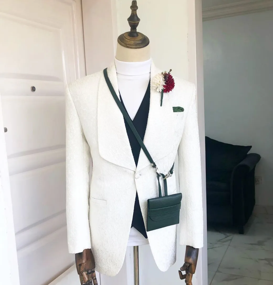 An Ivory White “Wedding In The Jungle” shawl lapel tuxedo suit