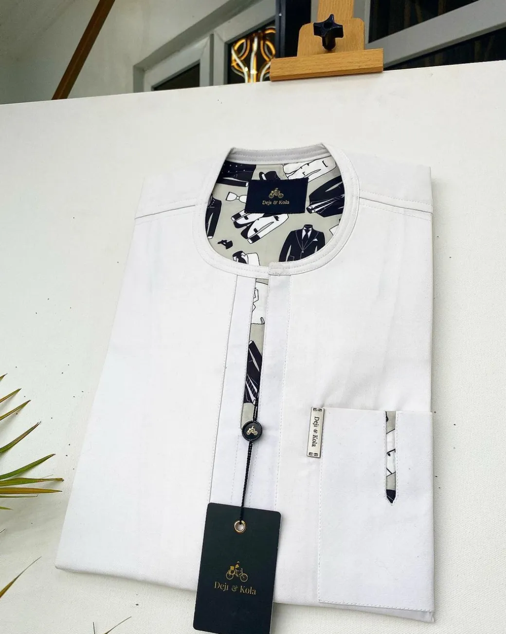 An Ivory white African Kaftan with paisley detailing and sokoto