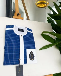 An Ivory white and blue check, black Swarovski buttons, front flap, Indian Hand embroidery badge details African traditional senator kaftan native.