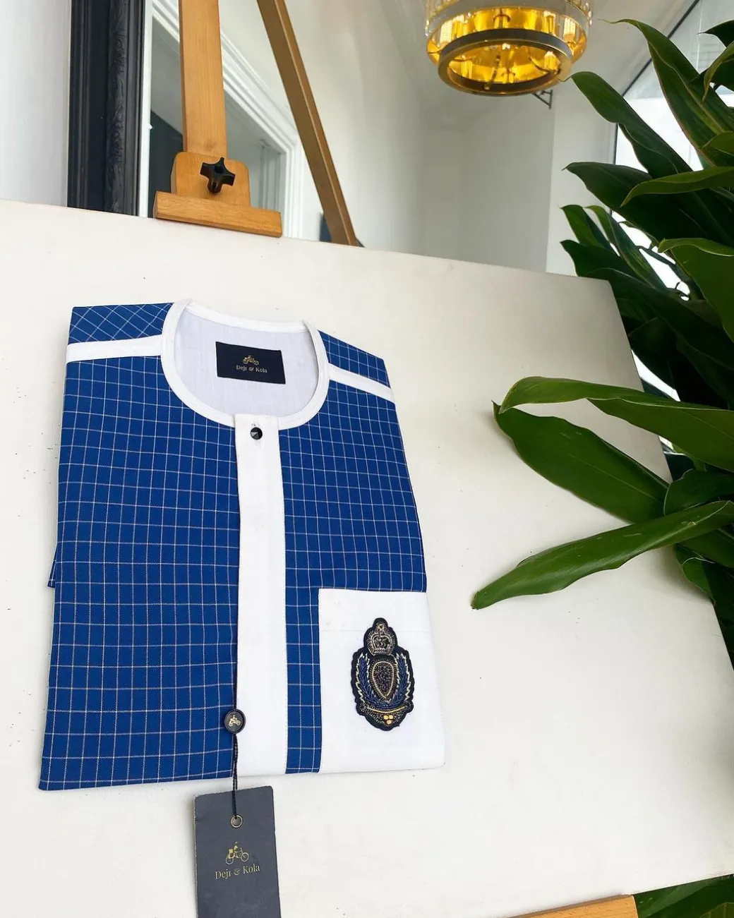 An Ivory white and blue check, black Swarovski buttons, front flap, Indian Hand embroidery badge details African traditional senator kaftan native.