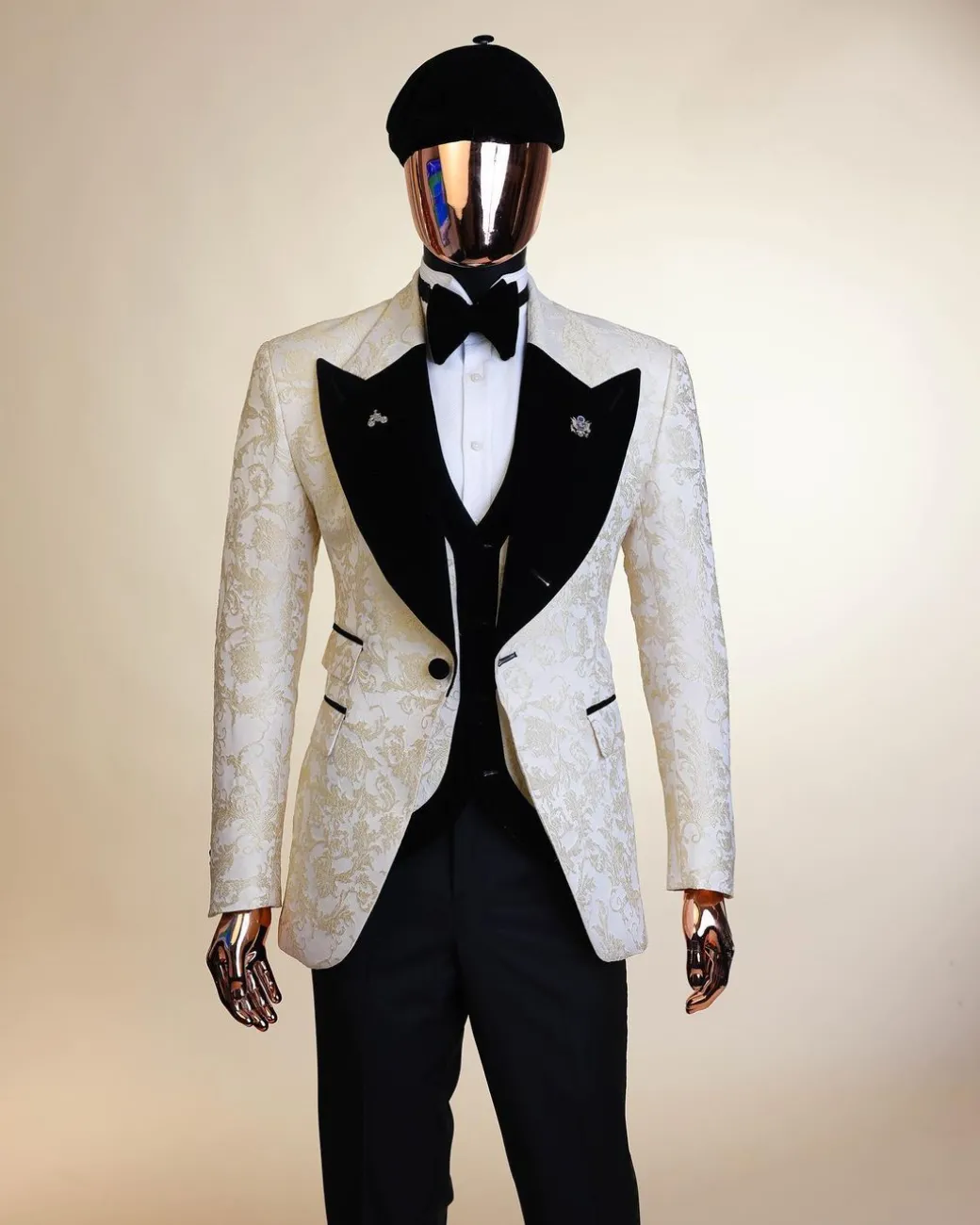 An Ivory white and Gold Floral patterned Peak lapel metallic jacquard tuxedo suit.