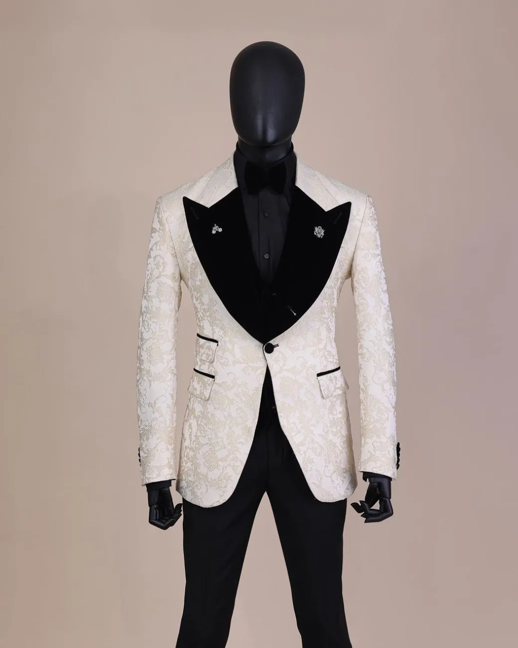 An Ivory white and Gold Floral patterned Peak lapel metallic jacquard tuxedo suit.