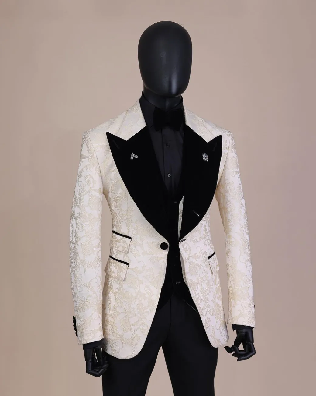 An Ivory white and Gold Floral patterned Peak lapel metallic jacquard tuxedo suit.