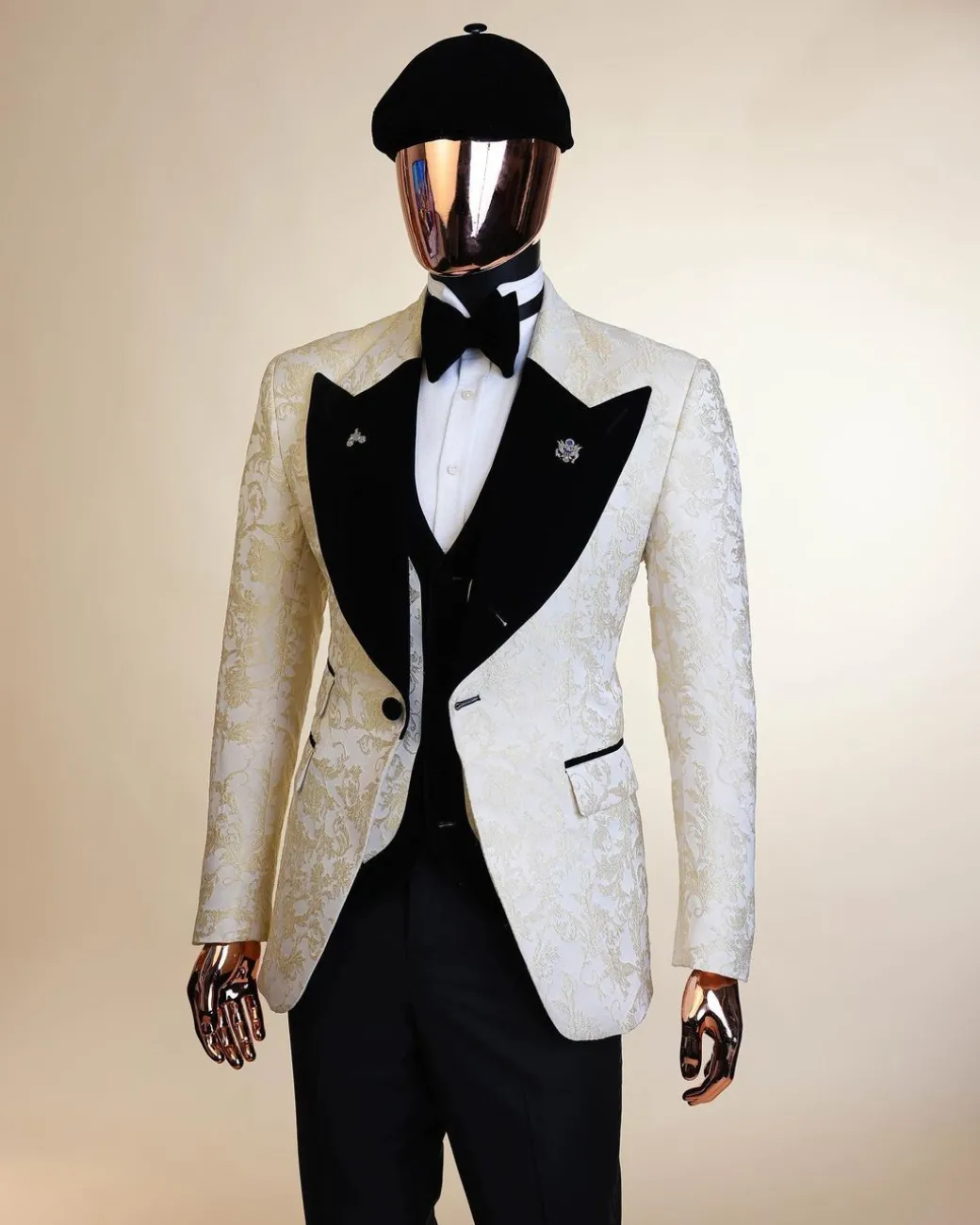 An Ivory white and Gold Floral patterned Peak lapel metallic jacquard tuxedo suit.