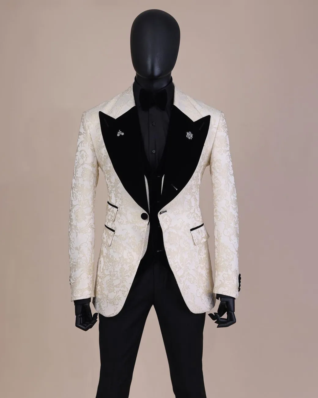 An Ivory white and Gold Floral patterned Peak lapel metallic jacquard tuxedo suit.