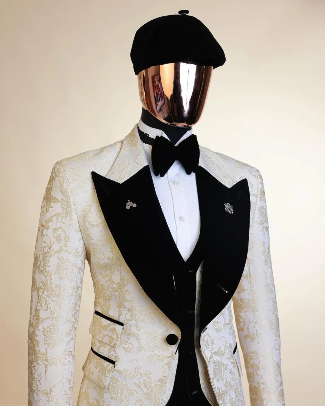 An Ivory white and Gold Floral patterned Peak lapel metallic jacquard tuxedo suit.