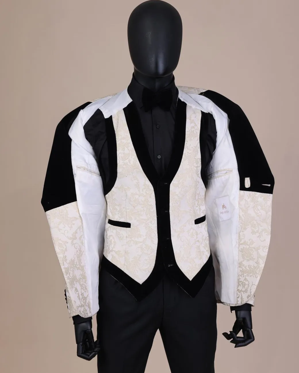 An Ivory white and Gold Floral patterned Peak lapel metallic jacquard tuxedo suit.