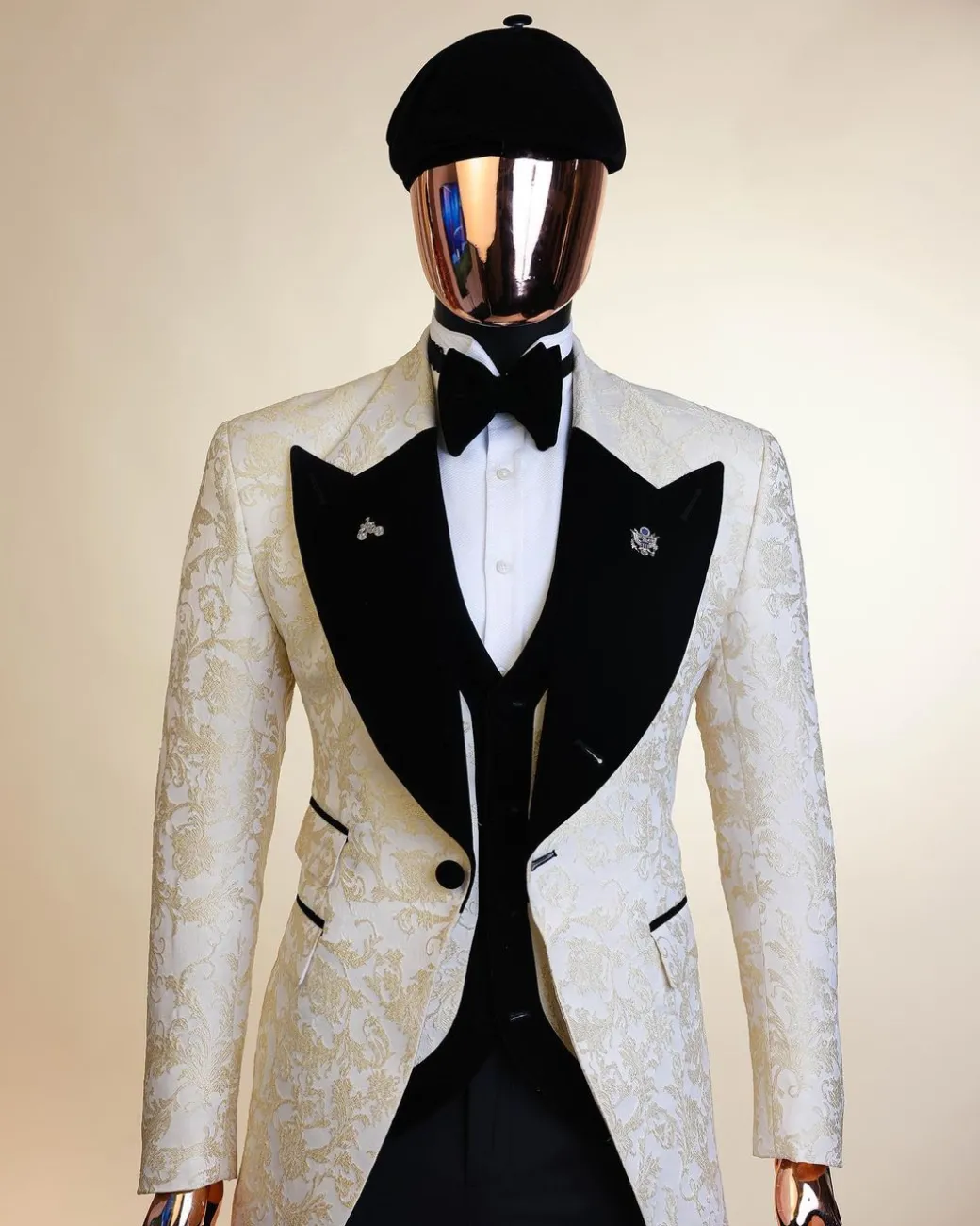 An Ivory white and Gold Floral patterned Peak lapel metallic jacquard tuxedo suit.