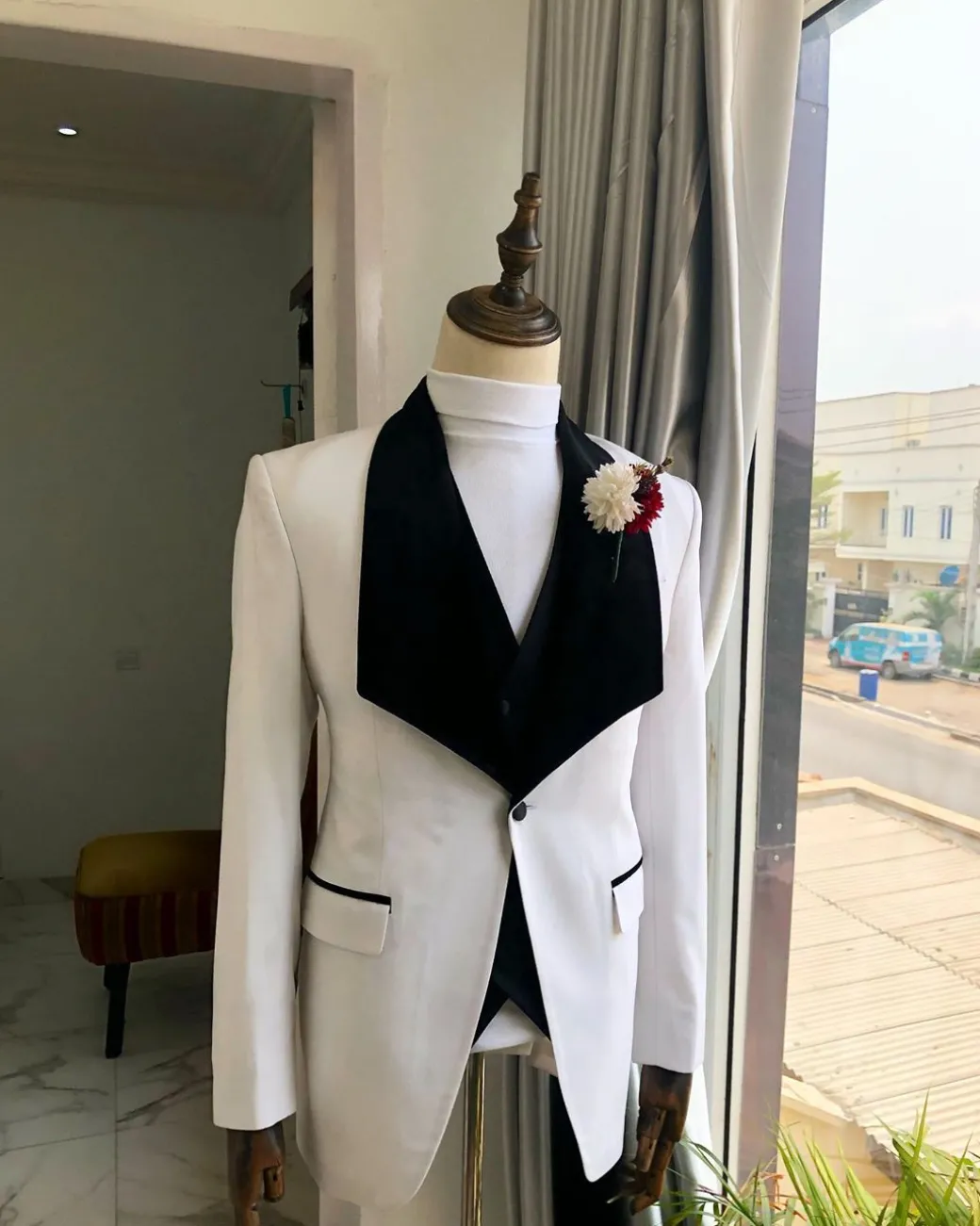 An Ivory White, Black Velvet Lapel tuxedo Suit