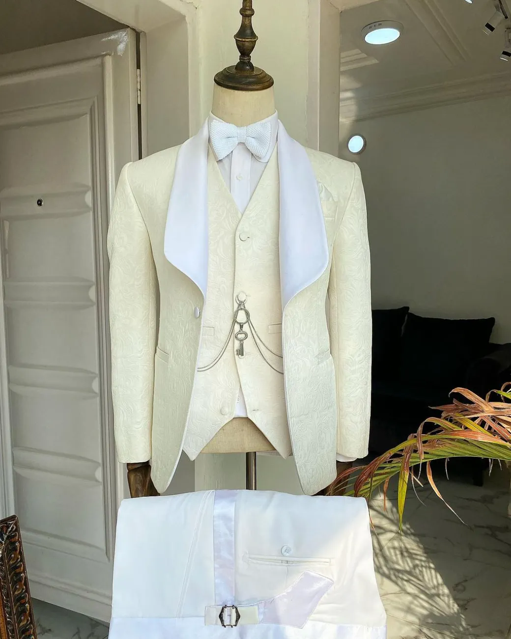 An Ivory White “Celestial” shawl lapel tuxedo tailored suit