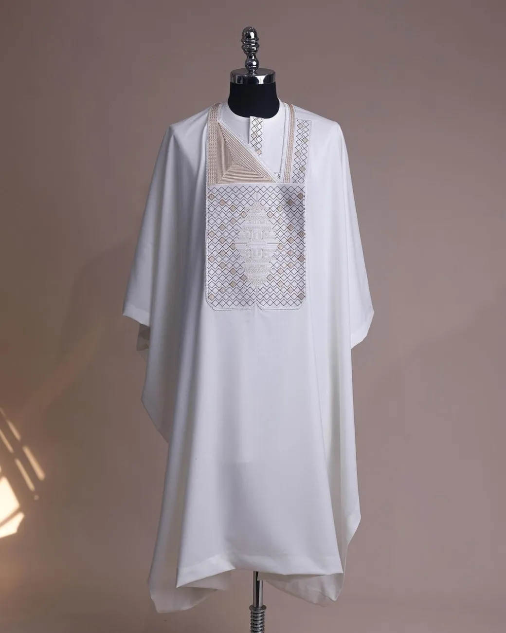 An Ivory white, chinoiserie chic pagoda with layers metallic wire embroidery details agbada